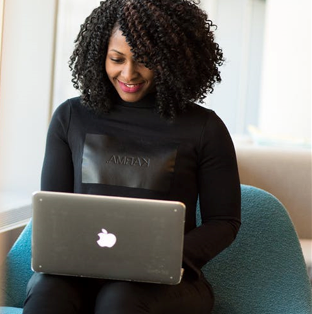 Lady sitting with a laptop