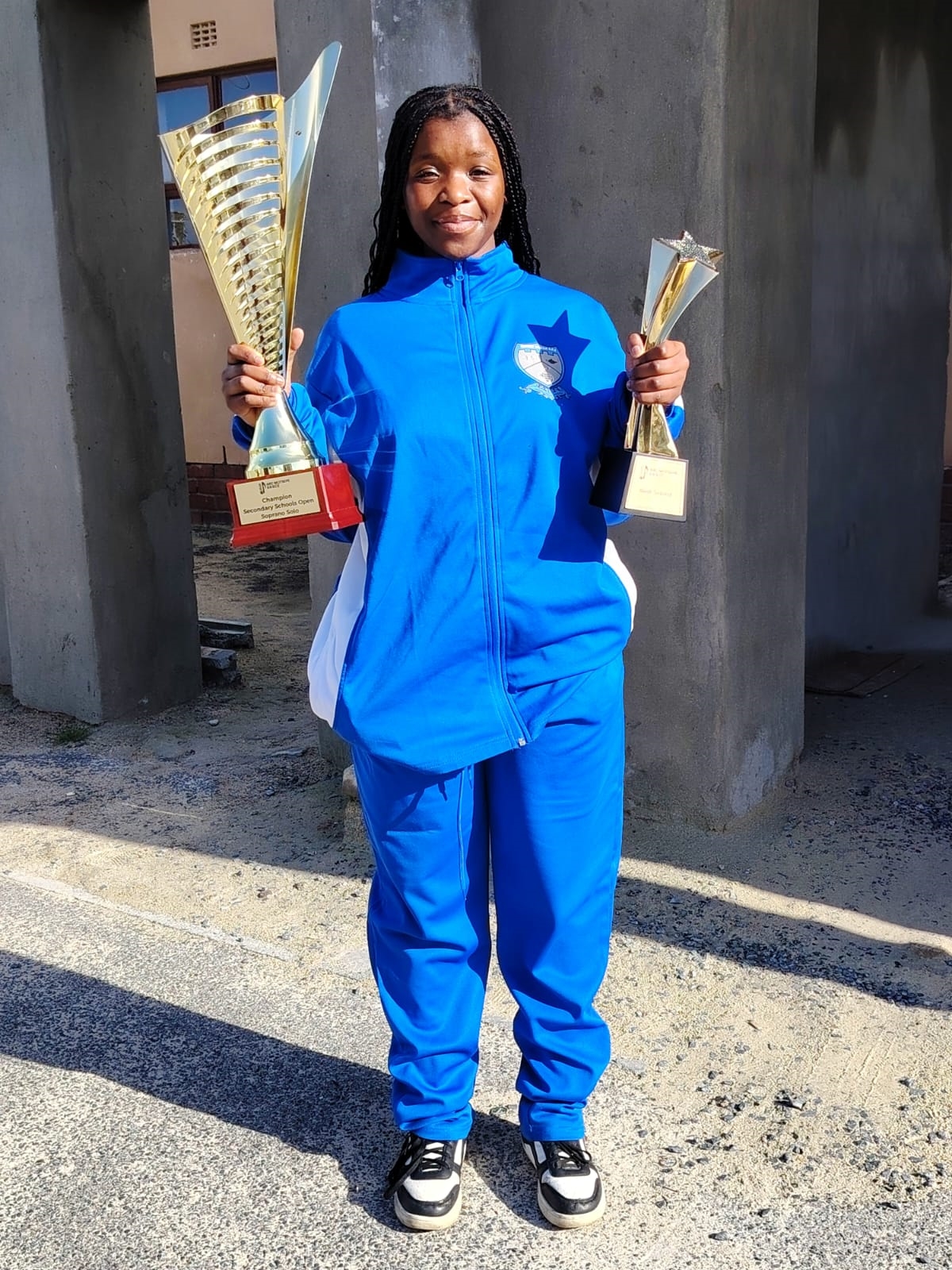 yongama-with-her-trophies.jpg