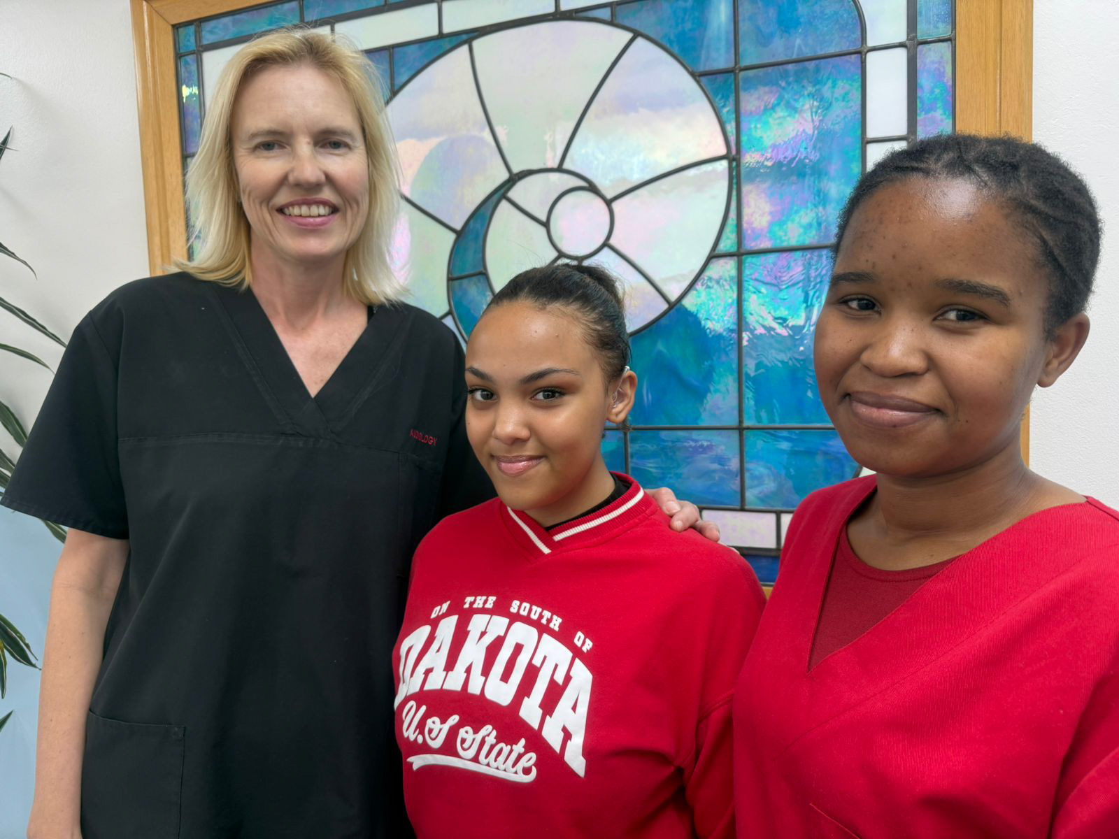From left to right – Jeannette Birkenstock, Assistant Director, Department of Speech Therapy and Audiology at Tygerberg Hospital; Micah Classen; Nokwanda Ndlovu, Audiologist at Tygerberg Hospital