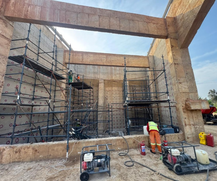Installing steel to reinforce bridge abutment