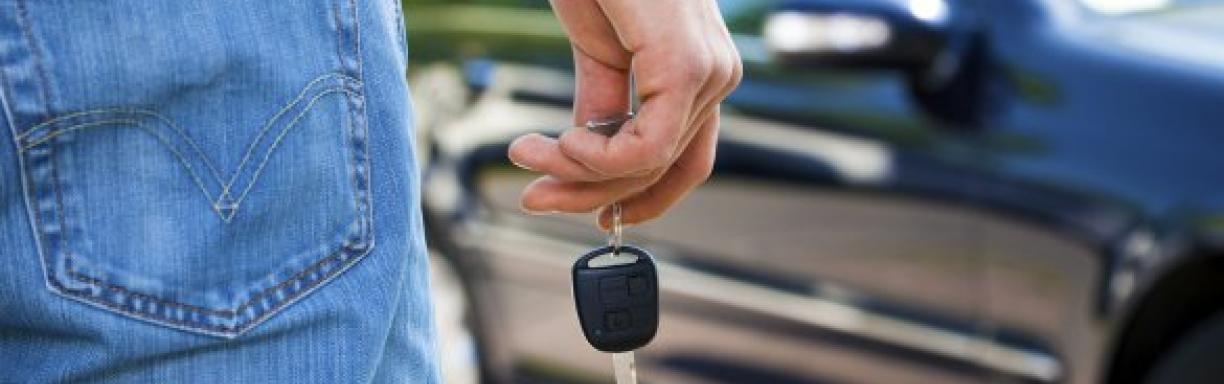 Man with car key