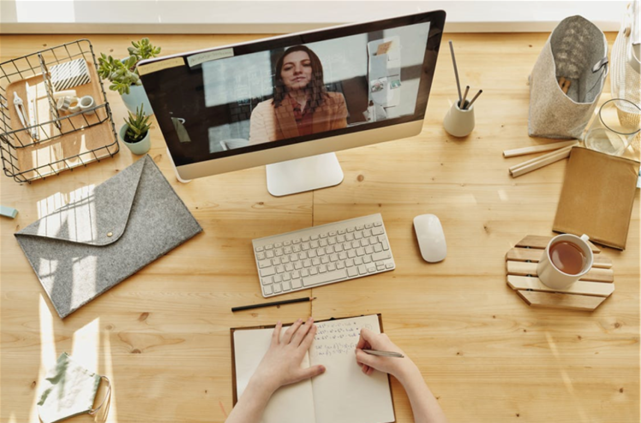 person-sitting-at-a-desk-doing-online-training