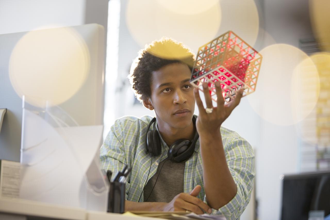 man looking at rubix