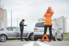 Young woman calling for help at an accident scene.