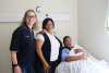 Mireille Wenger, Western Cape Minister of Health and Wellness, pictured with Sr Lydia Dreyer and mother Geneva Claasen at Mowbray Maternity Hospital.