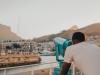 man-looking-through-a-telescope-at-va-waterfront.jpg