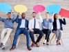 Group of people holding speech bubbles signs