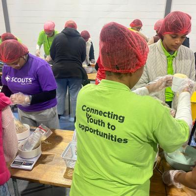 Scouts Yeboneers packing with Rise Against Hunger