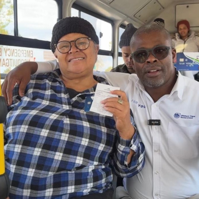 minister-sileku-with-a-resident-aboard-a-go-george-bus