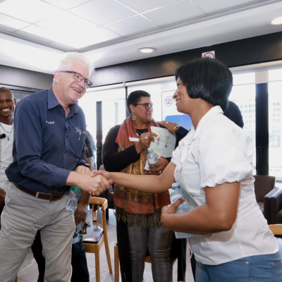Premier Winde and Yolanda Rangolie, a beneficiary of a WCG housing programme